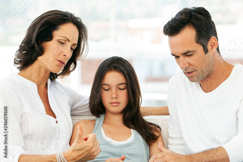 Responsible parents having educative discussion with teenage girl