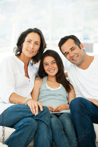 happy family with one child - teenage girl with parents - portrait