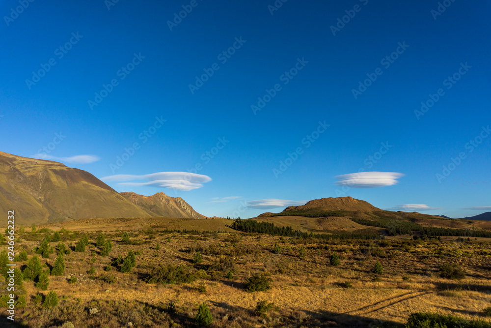 Andes mountain range against lenticular clouds in the sky