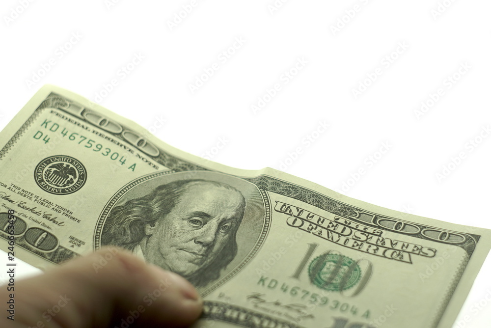 One hundred dollars in hand on a white background One hundred dollars in hand on a white background