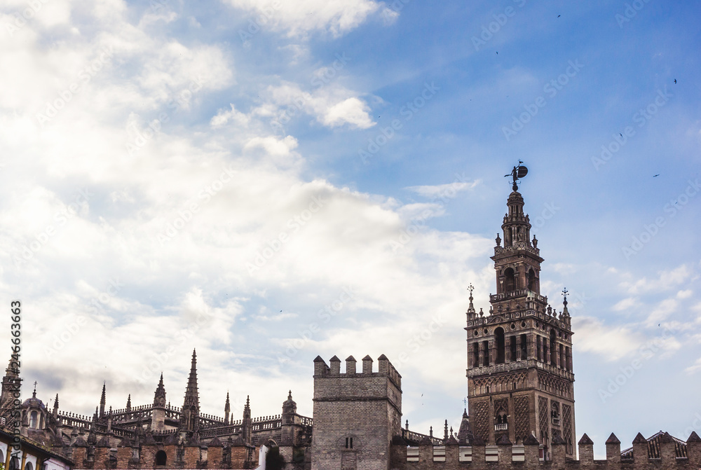 View with Dome of Seville Cathedral, Giralda, Giraldillo and outer wall of Alcázar of Seville