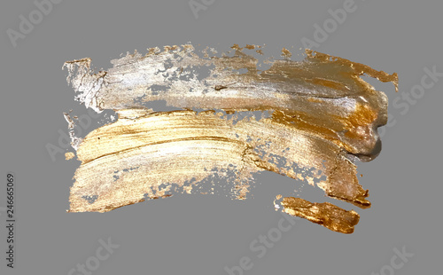 hand drawing gold brush stroke paint spot on a gray background