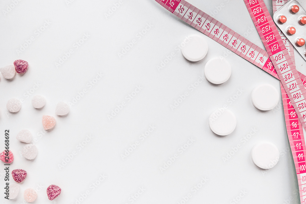 Weight loss unhealthy and dangerous concept pills on a white background Weight loss unhealthy and dangerous concept pills on a white background