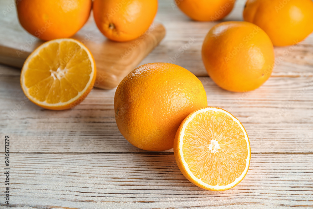 Fresh juicy oranges on wooden table. Healthy fruits Fresh juicy oranges on wooden table. Healthy fruits
