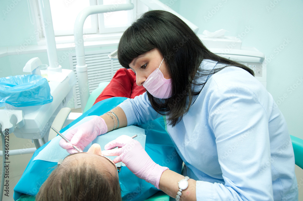 Doctors of the dental surgical department perform a dental surgical operation. Doctors of the dental surgical department perform a dental surgical operation.