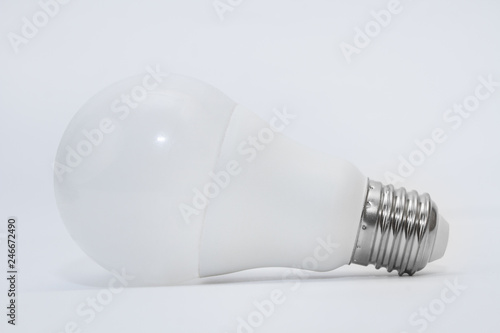 Light bulb on a gray background. Side view