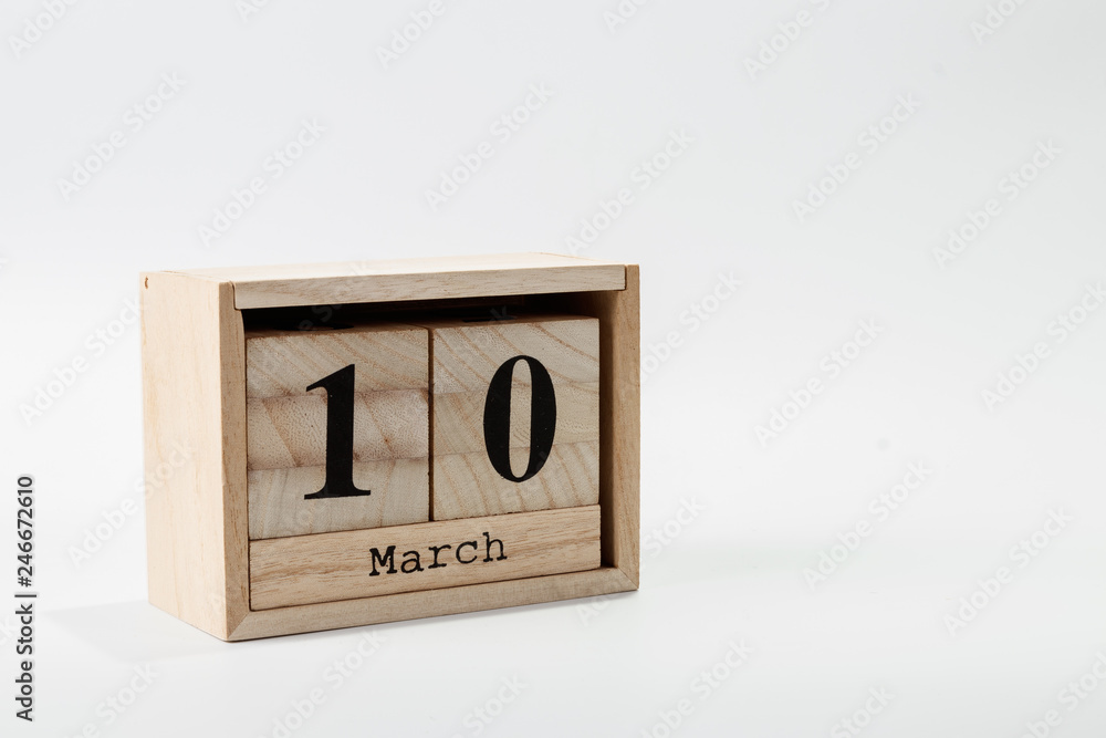 Wooden calendar March 10 on a white background Wooden calendar March 10 on a white background