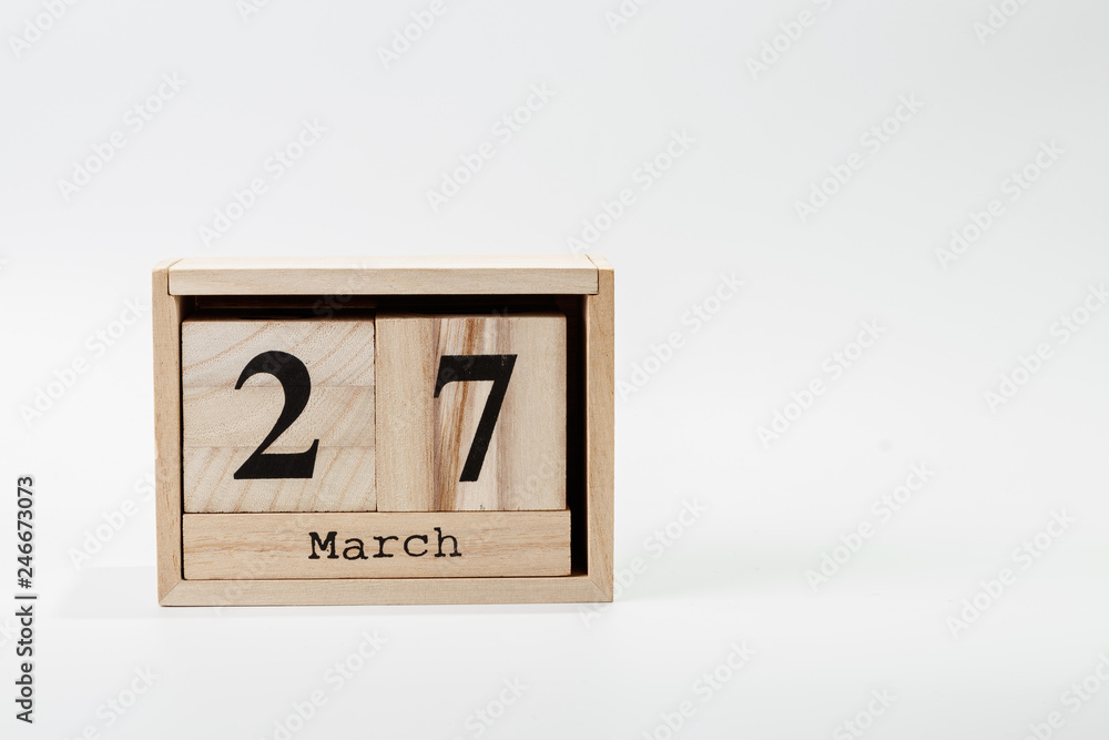 Wooden calendar March 27 on a white background Wooden calendar March 27 on a white background