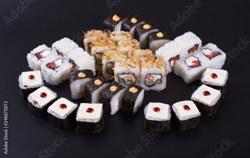 Japanese rolls with seafood on a dark background