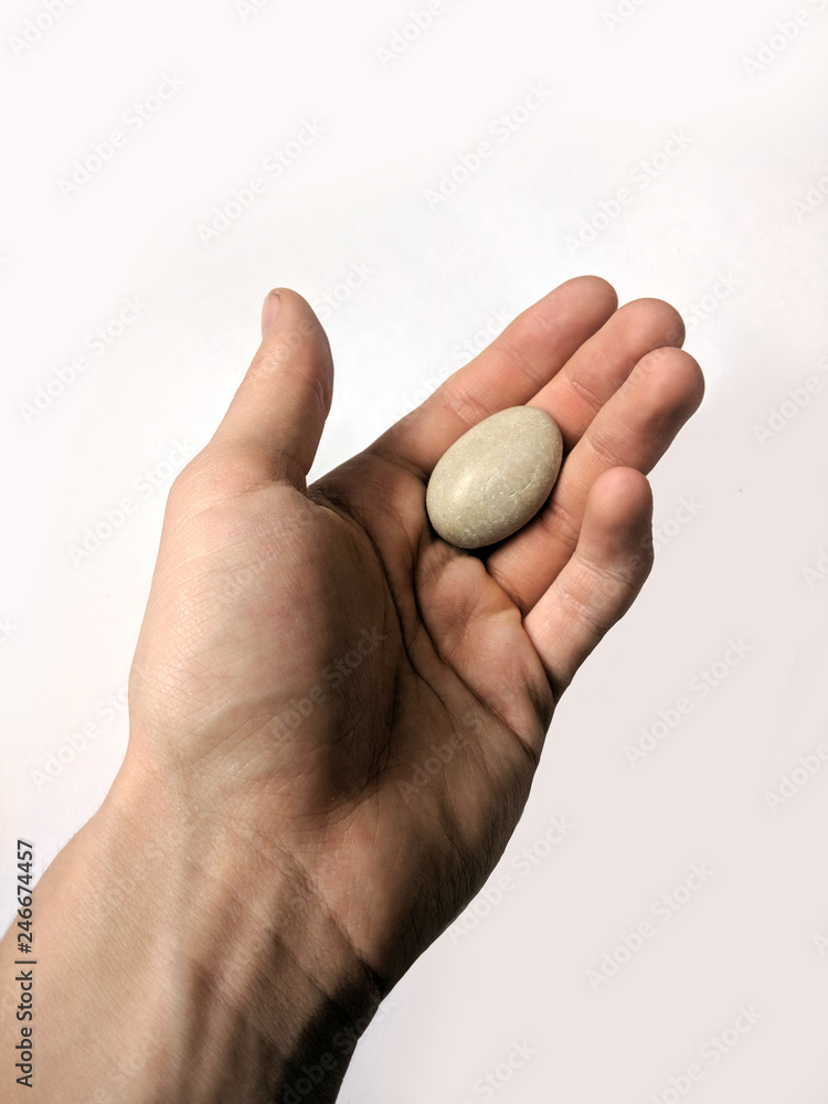 pebbles in hand isolated on white background pebbles in hand isolated on white background