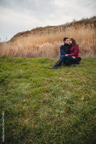 Close up of romantic attractive young couple hugging and kissing outdoors © Iryna Budanova
