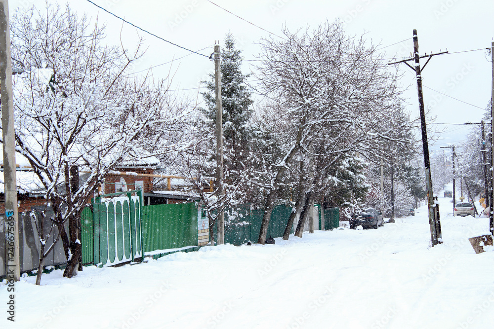 winter street is deserted and the house in the snow winter street is deserted and the house in the snow