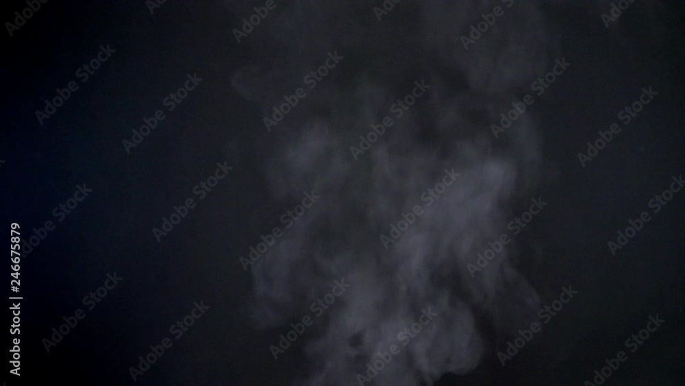 Closeup shot of great vapouring fume with sprays flying upwards on black background. Closeup shot of great vapouring fume with sprays flying upwards on black background.
