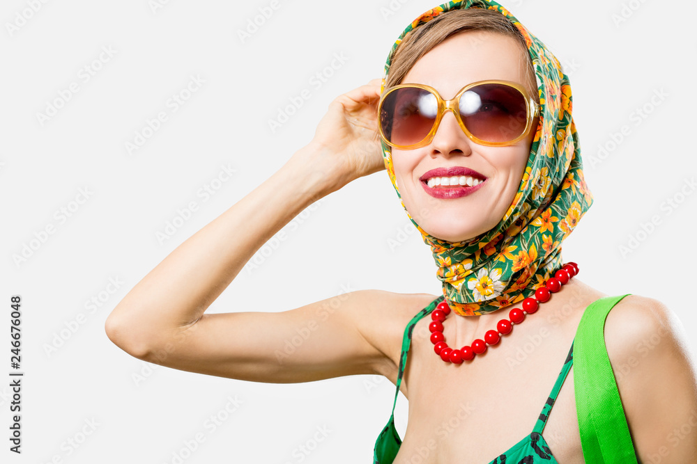 Portrait of smiling happy woman wearing scarf and sunglasses. Spring beauty Portrait of smiling happy woman wearing scarf and sunglasses. Spring beauty