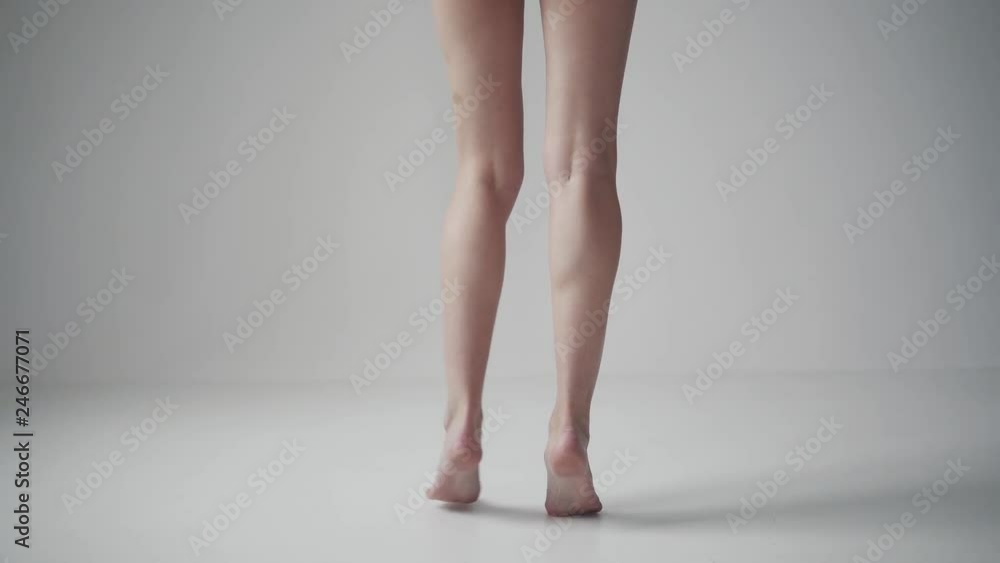 female legs close up. girl spinning on tiptoes barefoot female legs close up. girl spinning on tiptoes barefoot