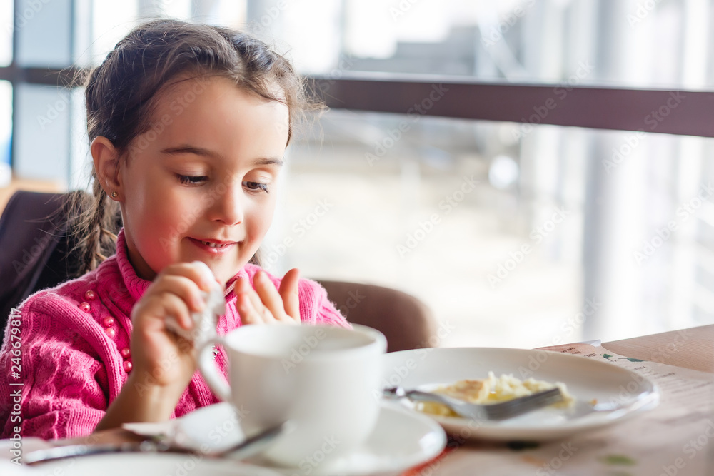 cute little girl drinks tea in the morning cute little girl drinks tea in the morning