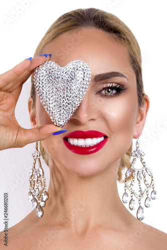 Obraz na plátně Valentine Beauty girl with silver heart jewelry and in elegant makeup isolated on white background