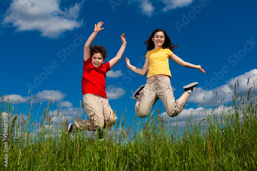 Girl and boy running  jumping outdoor