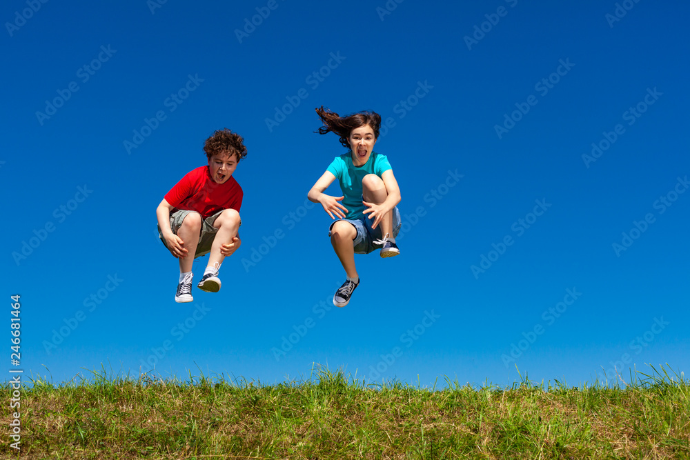 Girl and boy running, jumping outdoor Girl and boy running, jumping outdoor