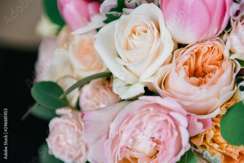 Beautiful tender wedding bouquet of pink roses is on the chair. bridal bouquet, floral arrangement