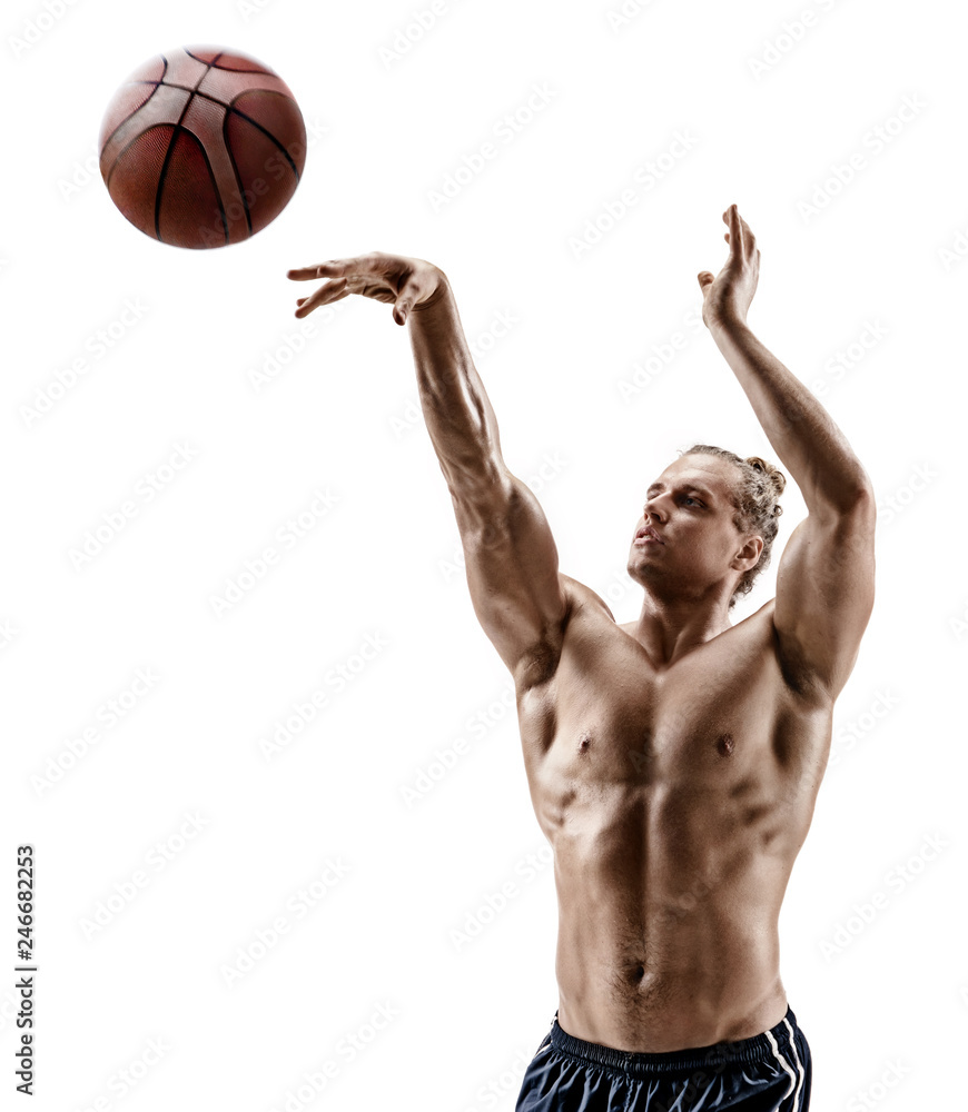 Muscular basketball player shooting at the hoops. Photo of