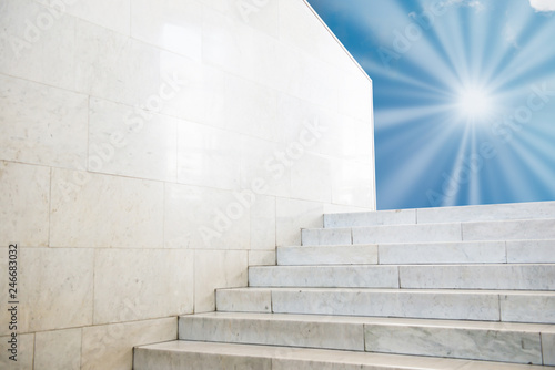Sun shining on sky on marble staircase