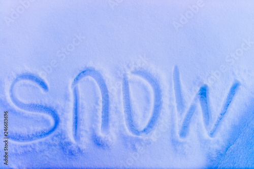 the word "snow" written in the snow