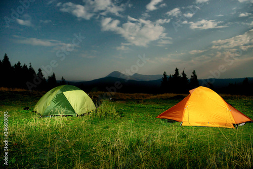 Fototapeta Naklejka Na Ścianę i Meble -  Twp illuminated camping tents