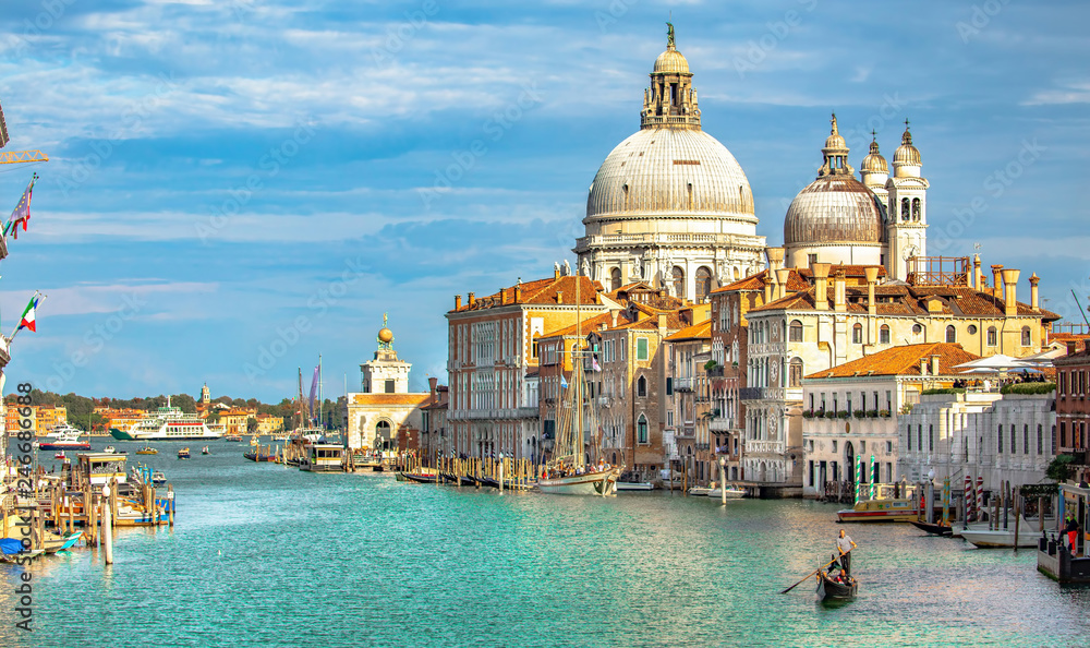 Italy beauty, cathedral Santa Maria della Salute and gondola on Grand canal in Venice, Venezia