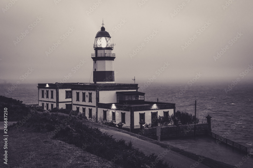 Cape Silleiro lighthouse on a stormy day. The lighthouse is located in Baiona province of Pontevedra, Spain Cape Silleiro lighthouse on a stormy day. The lighthouse is located in Baiona province of Pontevedra, Spain