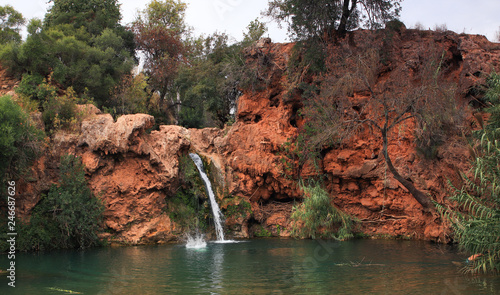 Splash in the water at Pego Do Inferno waterfall in Algarve  Portugal. Hidden and secret waterfall and pond that is very cold and refreshing. 