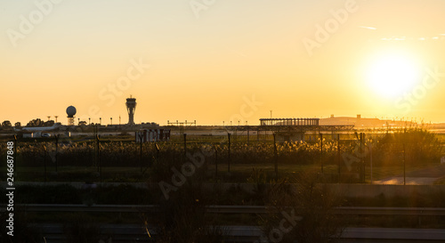 airport in Barcelona with the sunset and the sun going down and the sky clear