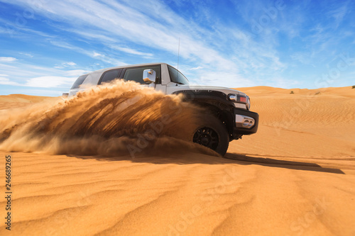 Drifting offroad car 4x4 in desert