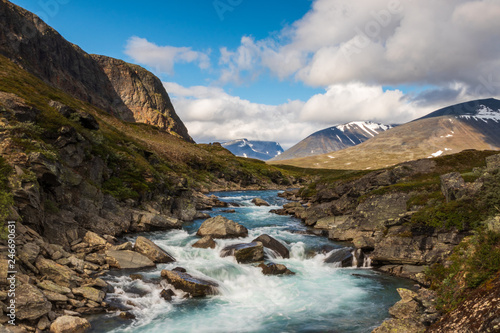 Flowing water in a river during the hike of Kungsleden  Kings path  in northern Sweden. 