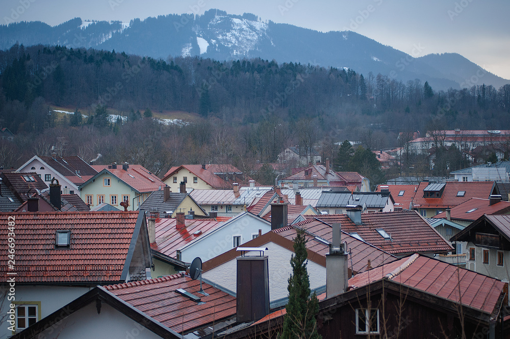 View of the roofs of houses and mountains on a cloudy day. Historic medieval town Bad Toelz, Germany