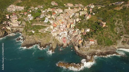 Drone shot orbiting around Riomaggoire along the Italian coast photo