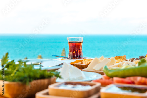 Breakfast on the beach at hotel or resort by the sea in summer season. Holiday and vacation breakfast image.