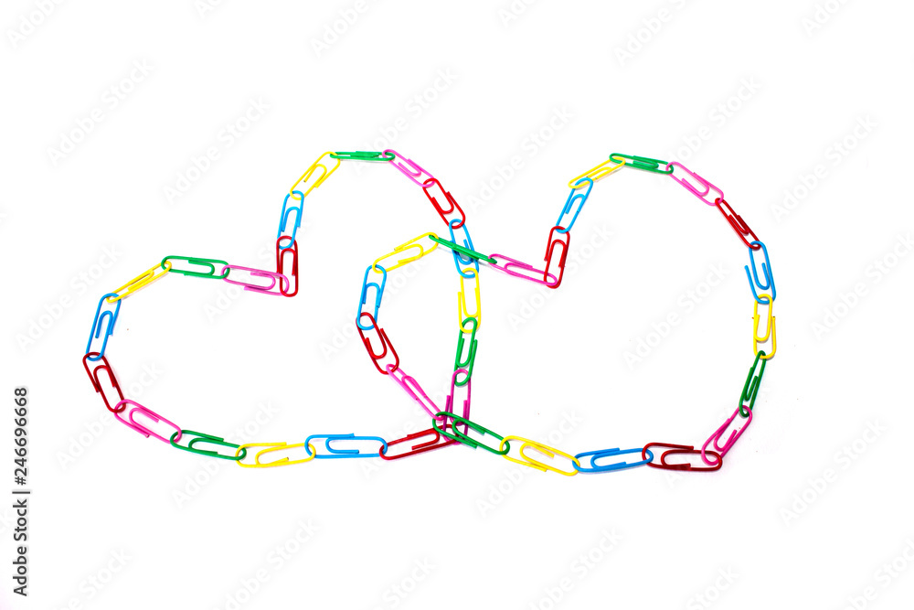 two colorful hearts from paperclips on the white