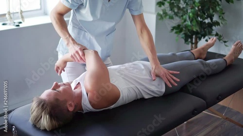 A Modern rehabilitation physiotherapy worker with woman client