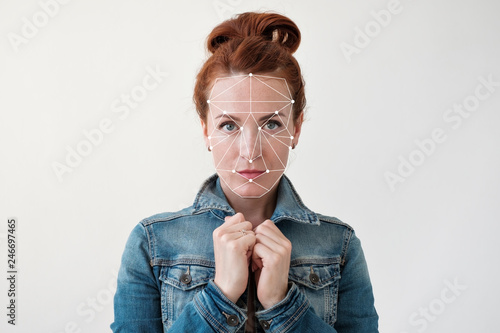 Face recognition of a middle aged red haired woman photo