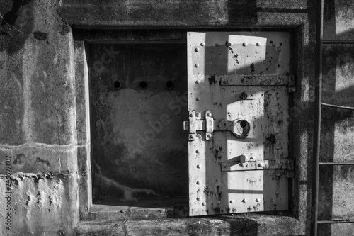 Rusting steel door at Fort Worden - an abandonded WWI era military installation © Elaine