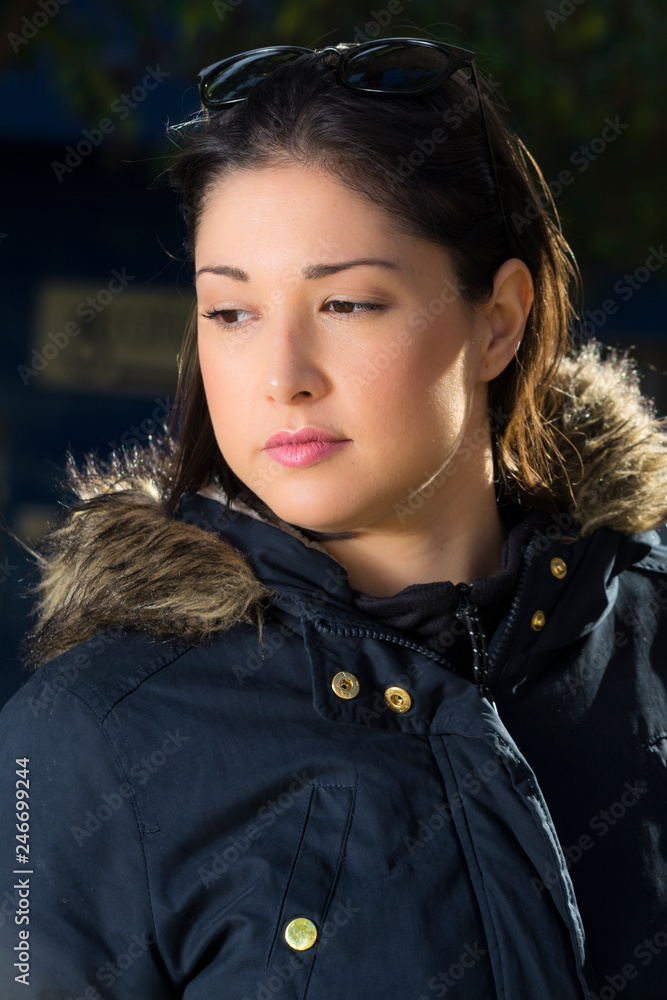 portrait of brunette girl in the park portrait of brunette girl in the park