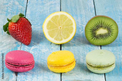 Colored macarons and fresh fruit.
