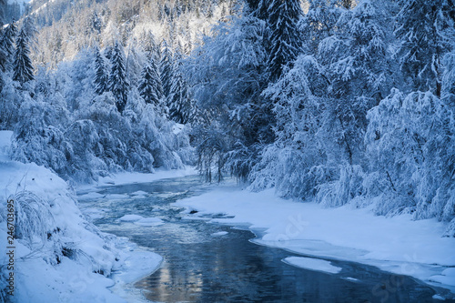 Winter wonderland with river in Switzerland
