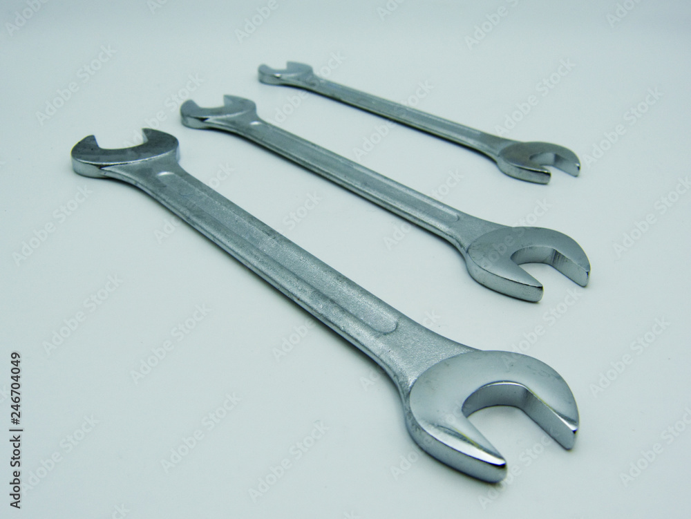 View of three wrenches against white background View of three wrenches against white background