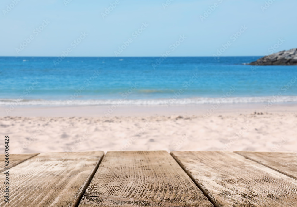Fototapeta premium Picturesque view of sand beach and wooden walkway