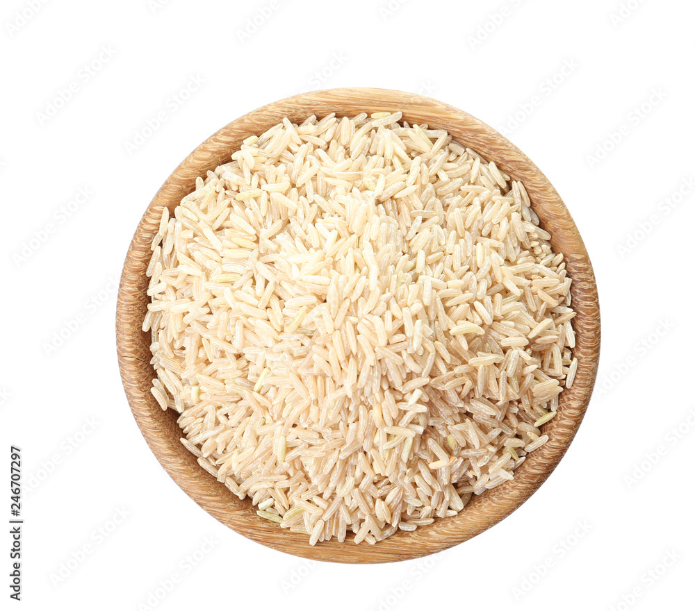 Bowl with uncooked brown rice on white background, top view Bowl with uncooked brown rice on white background, top view