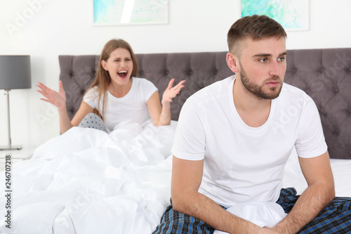 Young couple arguing in bedroom. Relationship problems