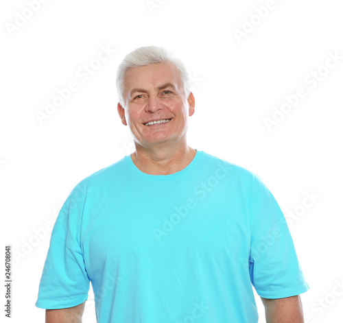 Portrait of mature man laughing on white background © New Africa