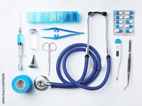 Flat lay composition with medical objects on white background